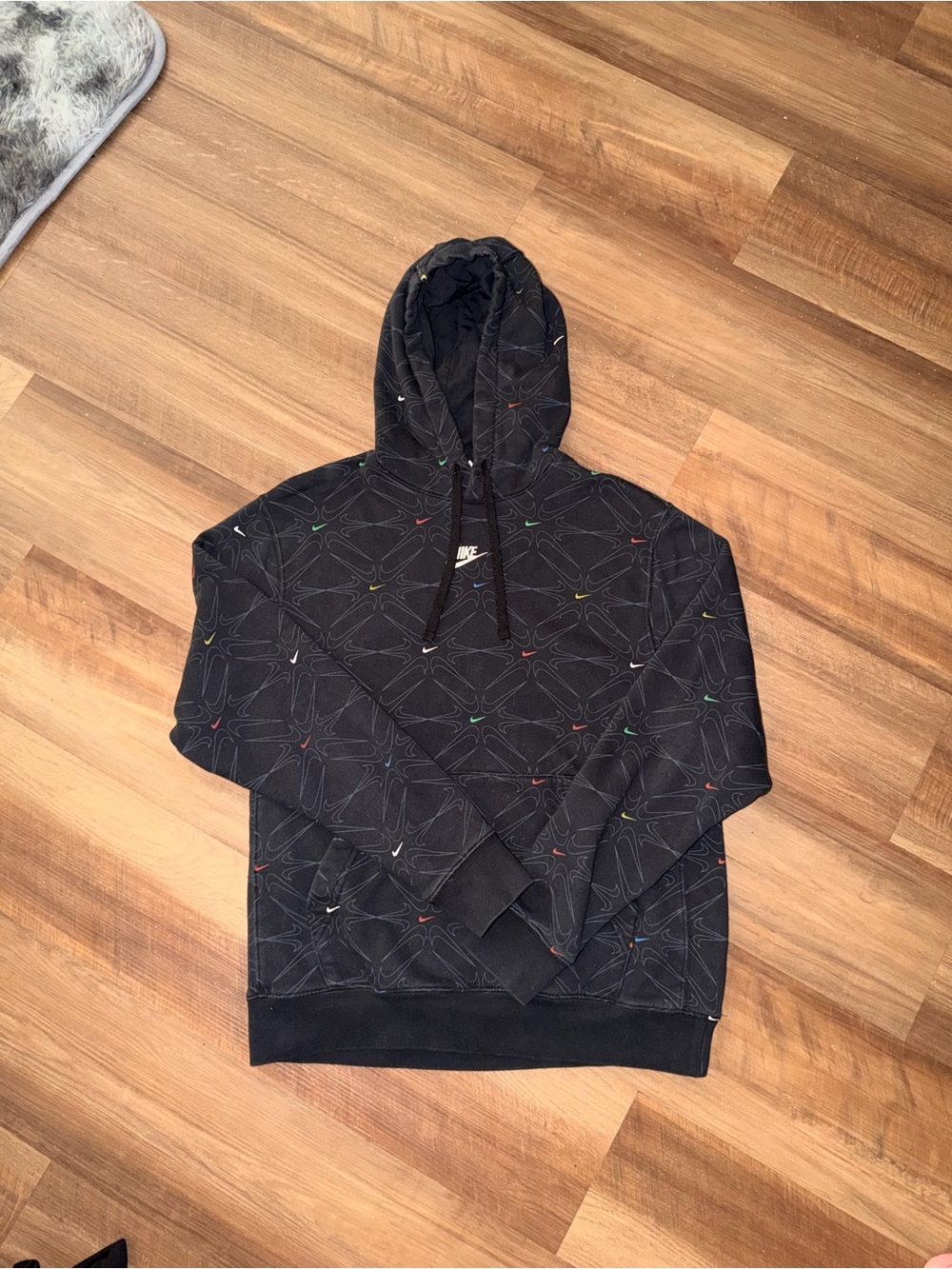 Nike Black Hoodie with Multicolor Swoosh Pattern